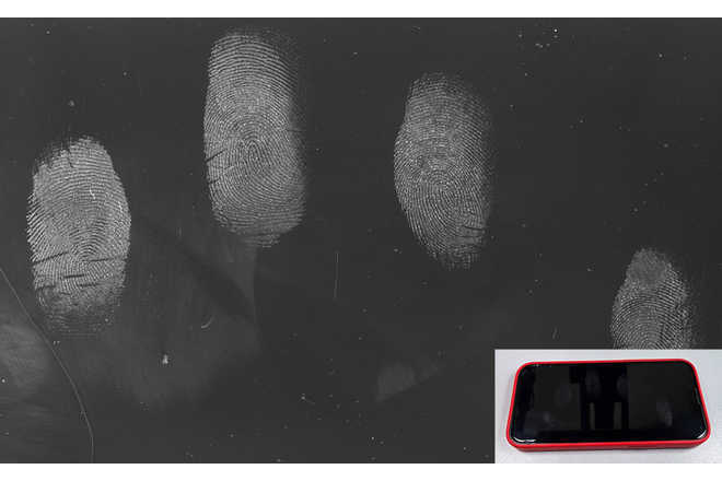 Fingerprints on a mobile phone display captured by DactyScope. image