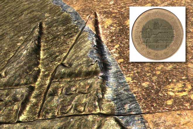 3D detail of different materials on a 50 CZK coin image